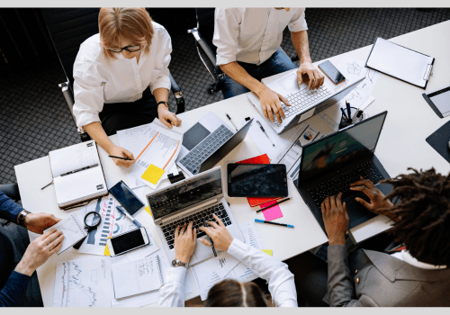 Tech Support Team collaborating at a table